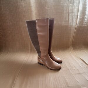 leather 8 1/2 wide calf  saddle brown, with gold hardware. No signs of wear.